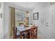 Bright dining area with pendant lighting, wood table, and window view at 274 Giovani Blvd, Clermont, FL 34715