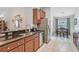 Spacious kitchen featuring granite countertops, stainless steel appliances, and ample cabinet space at 274 Giovani Blvd, Clermont, FL 34715