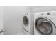 A white laundry room featuring a side-by-side washer and dryer at 274 Giovani Blvd, Clermont, FL 34715