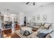 Open-concept living area with hardwood floors, a dining table, and a view of the kitchen at 274 Giovani Blvd, Clermont, FL 34715