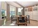 Bright breakfast nook featuring a cozy round table and a built-in cabinet, perfect for enjoying morning meals at 287 Ellenton Run, The Villages, FL 32162