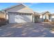 Charming single-story home featuring a spacious two-car garage and well-maintained front yard landscaping at 287 Ellenton Run, The Villages, FL 32162