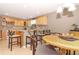 Open kitchen with a breakfast bar and adjacent dining area, ideal for casual dining and entertaining at 287 Ellenton Run, The Villages, FL 32162
