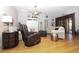 Spacious living room with hardwood floors, comfortable seating, and stylish decor creating a cozy atmosphere at 287 Ellenton Run, The Villages, FL 32162
