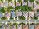 Bird's eye view of a residential neighborhood with manicured lawns and tree-lined streets at 2894 Southern Pines Loop, Clermont, FL 34711