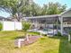 Backyard with an enclosed pool and spa area surrounded by a white fence at 2894 Southern Pines Loop, Clermont, FL 34711