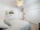 Bright bedroom with a decorative ceiling fan, closet, and soothing decor at 2894 Southern Pines Loop, Clermont, FL 34711