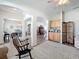 Open concept living space with wood floors, archways, and access to the dining room at 2894 Southern Pines Loop, Clermont, FL 34711