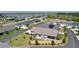 Aerial view of a landscaped backyard, with a fenced perimeter and relaxing patio furniture at 2919 Gulley Ln, The Villages, FL 32163