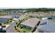 Neighborhood view showcasing a single-Gathering home with a well-manicured lawn and an attractive perimeter fence at 2919 Gulley Ln, The Villages, FL 32163