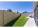 Fenced yard, landscaping, and easy access to screened in porch from back door at 2919 Gulley Ln, The Villages, FL 32163
