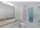 Clean bathroom with shower-tub combo and vanity with framed mirror at 2919 Gulley Ln, The Villages, FL 32163