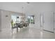 Charming dining area with tile floors, large window, and access to the front door at 2919 Gulley Ln, The Villages, FL 32163