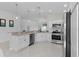 Modern kitchen featuring stainless steel appliances, plenty of counter space, and modern decor at 2919 Gulley Ln, The Villages, FL 32163