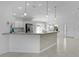 Spacious kitchen featuring white cabinets and an island, ideal for entertaining at 2919 Gulley Ln, The Villages, FL 32163