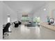 Open concept living space with tile flooring and ample natural light at 2919 Gulley Ln, The Villages, FL 32163