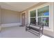 Charming covered front porch featuring a bench, perfect for relaxing outdoors at 2919 Gulley Ln, The Villages, FL 32163