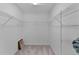 Walk-in closet with wire shelving and carpeted floor at 2919 Gulley Ln, The Villages, FL 32163