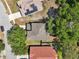 Aerial view of the property showcasing the roof, landscaping, and surrounding neighborhood at 30236 Pga Dr, Sorrento, FL 32776