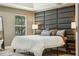 Bedroom featuring a bed with decorative headboard, nightstands, and lamp lighting at 30236 Pga Dr, Sorrento, FL 32776