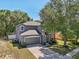 Beautiful two-story home with a well-maintained lawn, two-car garage, and mature trees at 30236 Pga Dr, Sorrento, FL 32776