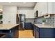 Charming kitchen features granite countertops, stainless steel appliances, and decorative backsplash at 30236 Pga Dr, Sorrento, FL 32776
