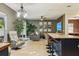 Bright, open living room with a large window, recessed lighting, and a ceiling fan at 30236 Pga Dr, Sorrento, FL 32776