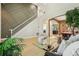 Open floor plan with a staircase, dining area, and living space with high ceilings at 30236 Pga Dr, Sorrento, FL 32776