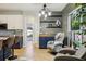 Cozy living area features a bar area and serene views of the backyard at 30236 Pga Dr, Sorrento, FL 32776