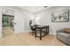Office space with a large desk, swivel chair, hardwood floors, and a comfortable place to relax at 30236 Pga Dr, Sorrento, FL 32776