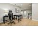 Second story office space with a large desk, swivel chair, hardwood floors, and plenty of natural light at 30236 Pga Dr, Sorrento, FL 32776