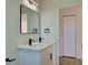 Bathroom featuring a modern vanity with black fixtures and marble-look countertop at 307 Big Black Ln, Poinciana, FL 34759