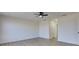 Spacious and bright bedroom with wood-look floors, modern fan, and ample space at 307 Big Black Ln, Poinciana, FL 34759