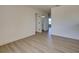 Neutral bedroom with wood-look floors and a window at 307 Big Black Ln, Poinciana, FL 34759