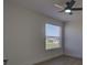 Neutral bedroom featuring a ceiling fan and a window overlooking the neighborhood at 307 Big Black Ln, Poinciana, FL 34759