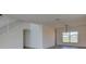 Bright living room featuring modern lighting and hardwood flooring at 307 Big Black Ln, Poinciana, FL 34759