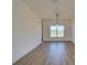 Bright living room featuring hardwood flooring and lots of natural light at 307 Big Black Ln, Poinciana, FL 34759
