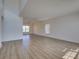 Bright living room featuring modern lighting and hardwood flooring at 307 Big Black Ln, Poinciana, FL 34759