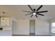 Bright living area with connected kitchen, and a modern ceiling fan at 307 Big Black Ln, Poinciana, FL 34759