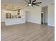 Open living space featuring a connected kitchen, tile backsplash, stainless steel appliances, and neutral walls at 307 Big Black Ln, Poinciana, FL 34759