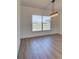 Bright living room featuring hardwood flooring and modern lighting at 307 Big Black Ln, Poinciana, FL 34759