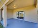 Covered patio with sliding glass door leading to the backyard at 307 Big Black Ln, Poinciana, FL 34759