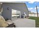 Back patio with an outdoor grilling space and a patio seating area at 308 Anorak St, Groveland, FL 34736