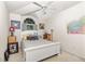 Bright bedroom boasts vaulted ceilings, arched window, and a comfortable queen-sized bed at 3785 Avon Ct, Clermont, FL 34711