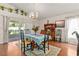 Traditional dining room with hardwood floors, chandelier, and sliding glass doors to outdoor space at 3785 Avon Ct, Clermont, FL 34711