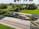 Aerial view showcases the beautiful Kings Ridge community entrance featuring a fountain and landscaping at 3785 Avon Ct, Clermont, FL 34711
