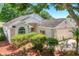 Well-maintained home with manicured landscaping, a two-car garage, and a neutral color scheme at 3785 Avon Ct, Clermont, FL 34711