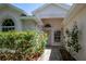 Charming front entrance with brick walkway, garden, and neutral paint, creating a welcoming curb appeal at 3785 Avon Ct, Clermont, FL 34711