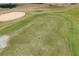 Aerial view showcases the scenic golf course hole and surrounding landscape at 3785 Avon Ct, Clermont, FL 34711