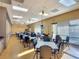 Bright and functional meeting room with tables, chairs, and plenty of natural light at 3785 Avon Ct, Clermont, FL 34711